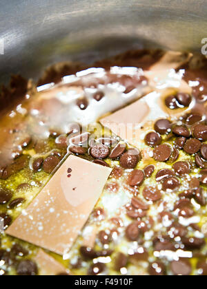 Chocolate melting in a saucepan, Sweden. Stock Photo