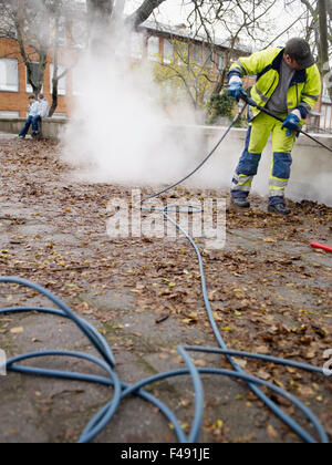 A man removing graffiti, Sweden. Stock Photo