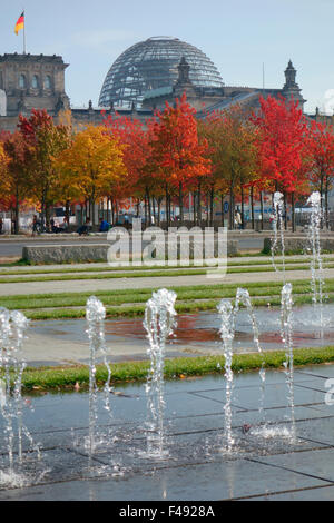 Autumn foliage and fountains in front of the Reichstag, Berlin, Germany Stock Photo