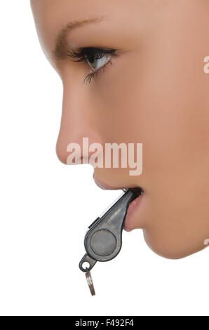 young woman holding whistle in his mouth Stock Photo