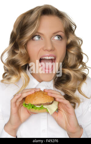young woman with hamburger looking away Stock Photo