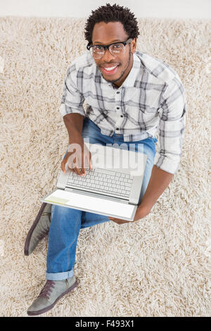 Young businessman types on the laptop Stock Photo