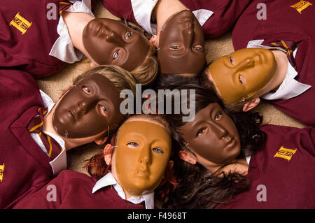 Hanham High School drama class,with girls wearing masks and lying in circle.a UK education learn classroom students pupil group Stock Photo