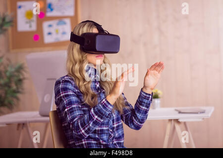 Pretty casual worker using oculus rift Stock Photo