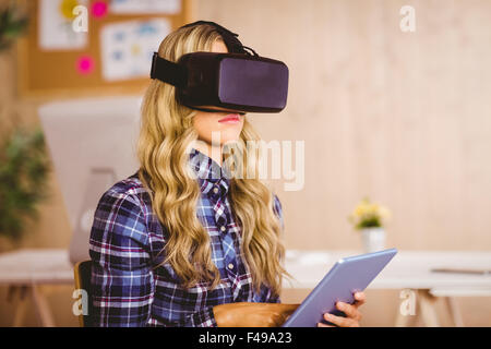 Pretty casual worker using oculus rift Stock Photo