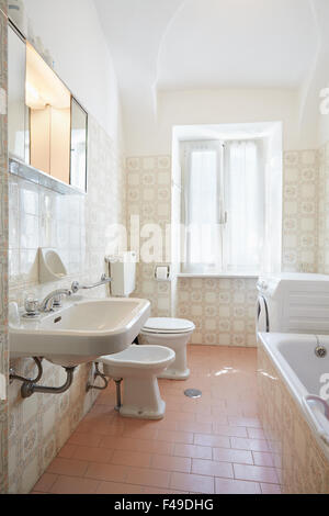 Simple, pink bathroom in old apartment Stock Photo