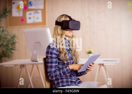 Pretty casual worker using oculus rift Stock Photo