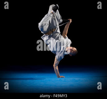 Breakdancer training on dark background Stock Photo