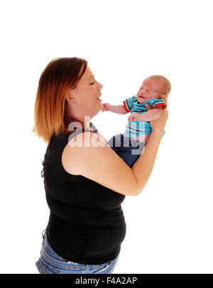 Mother holding her three week old boy. Stock Photo