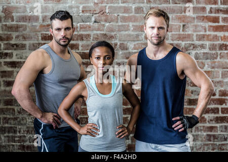 Fit serious people posing together Stock Photo