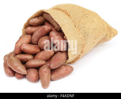 Potatoes in a sack bag over white background Stock Photo