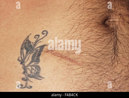 Tattoo at the navel hi-res stock photography and images - Alamy
