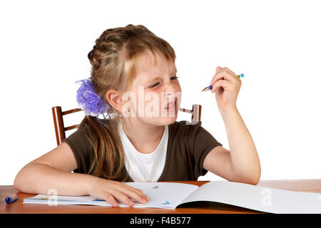 The red girl with freckles shows discontent Stock Photo