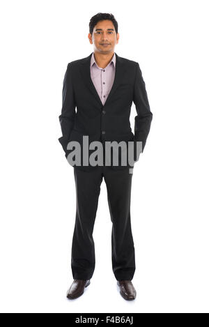 indian business man with coat standing Stock Photo