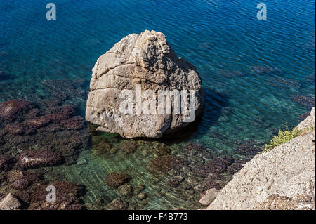 The peninsula of Crimea , Russia . Neighborhoods city of Sudak . Wild beaches of Cape Meganom Stock Photo