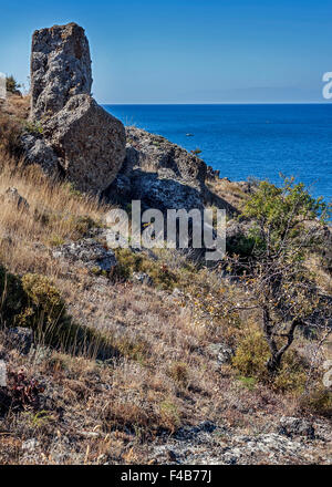 The peninsula of Crimea , Russia. Neighborhoods city of Sudak . The stark beauty of the wild beaches of Cape Meganom . Stock Photo