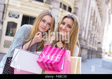 two friends out shopping together Stock Photo