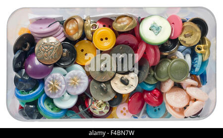 Old dusty vintage plastic buttons for repair of clothes in a box isolated Stock Photo
