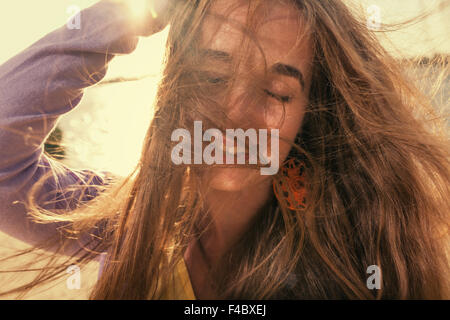 Long haired blonde outdoors wind Stock Photo