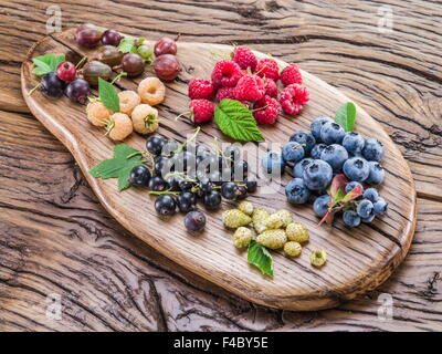 Ripe berries on the old wooden plank. Stock Photo