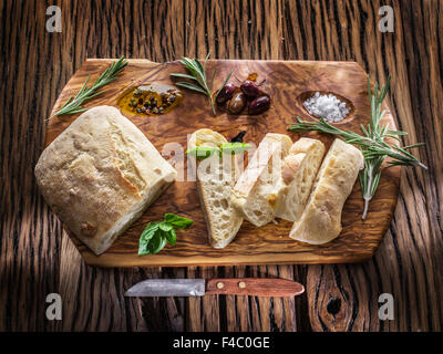 Сiabatta, olives and blue cheese on the wood. Stock Photo