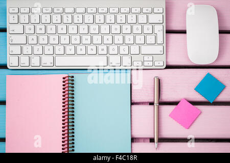 Wireless modern computer keyboard with the Turkish alphabet and white mouse and notebook Stock Photo