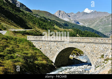 Valley Val-D'Isère the bridge St. Charles , Route des Grandes Alpes,  French Alps, France, view to La Grande Motte Stock Photo