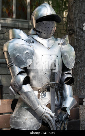 Medieval armor in front of the entrance to a castle. Stock Photo