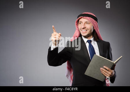 Arab man pressing virtual button Stock Photo