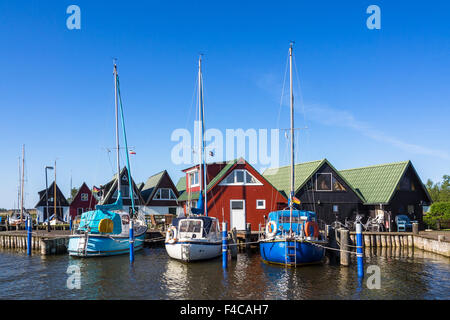Boathouses and sailing ships in Ahrenshoop (Germany) Stock Photo