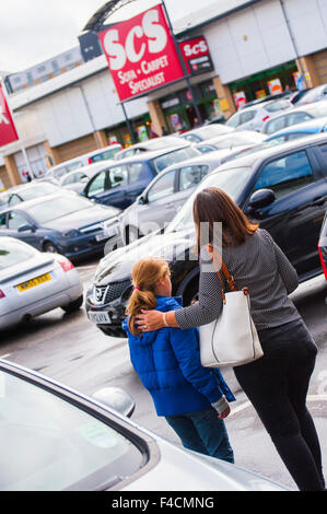 Middle class mum and daughter GV's , retail units and shoppers at Forster Square Retail Park, Bradford . A British Land PLC retail property. Stock Photo