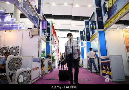 (151016) -- GUANGZHOU, Oct. 16, 2015 (Xinhua) -- A visitor is seen at the Thailand booth during the China Import and Export Fair, or the Canton Fair, in Guangzhou, capital of south China's Guangdong Province, Oct. 16, 2015. A total of 353 enterprises from countries and regions along the 'Belt and Road' participated the current Canton Fair held in Guangzhou, which took nearly 60 percent of all exhibitors. The 'Belt and Road' initiative, standing for the Silk Road Economic Belt and the 21st Century Maritime Silk Road, was unveiled by Chinese President Xi Jinping in 2013. It brings together count Stock Photo
