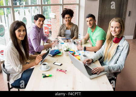 Students working on assignments together Stock Photo