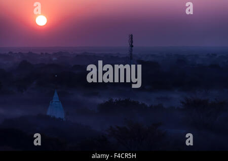 Sunrise over temples of misty and foggy Bagan in Myanmar Stock Photo