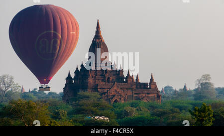Hot air balloon behind temple in Bagan Stock Photo