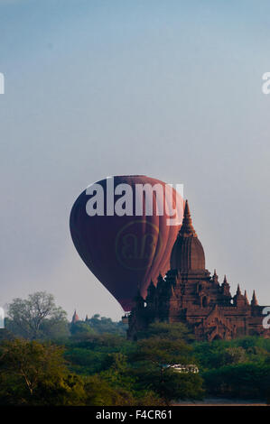 Hot air balloon behind temple in Bagan Stock Photo