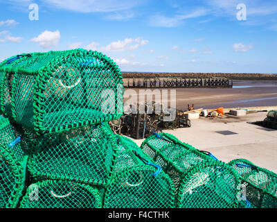 New Lobster Pots on the Quayside at Amble Harbour Amble by the Sea Northumberland England Stock Photo