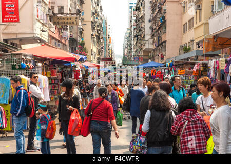 HONG KONG -MARCH 16: Shoppers and visitors crowd at a shopping street on March 16,, 2013 in Hong Kong, China. There are more tha Stock Photo
