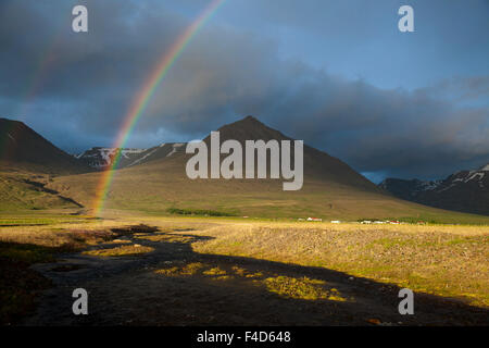 Evening rainbow over the Heradsvotn valley, Varmahlid, Skagafjordur, Nordhurland Vestra, Iceland. Stock Photo
