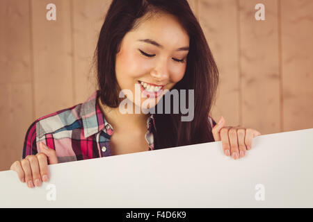 Beautiful woman holding blank sign Stock Photo