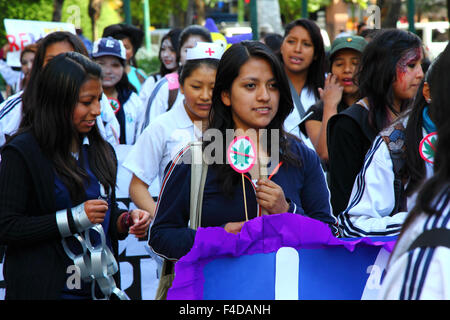 La Paz, Bolivia, 16th October 2015. A female student carries a 'No Marijuana' sign during a march through La Paz city centre warning of the dangers of drug use. The demonstration is organised every year by the police together with schools and colleges to educate and raise awareness about drugs and their dangers. Credit: James Brunker / Alamy Live News Stock Photo