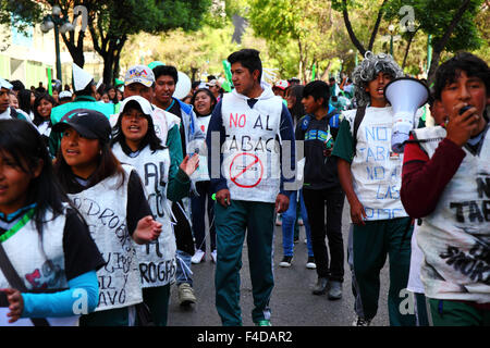 La Paz, Bolivia, 16th October 2015. Students wearing white sacks saying 'No to Tobacco' and 'No to Drugs' march through La Paz city centre warning of the dangers of drug use. The demonstration is organised every year by the police together with schools and colleges to educate and raise awareness about drugs and their dangers. Credit: James Brunker / Alamy Live News Stock Photo