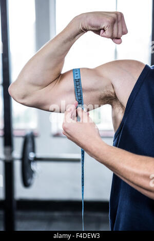 Man Measuring His Biceps With Measuring Tape On White Background Stock  Photo - Alamy