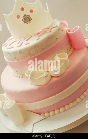 Decoration details of a birthday cake made for little baby girl, in pink and white. Stock Photo