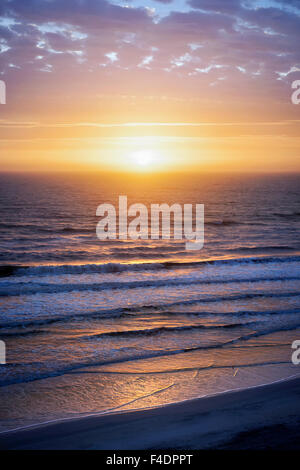 Sunrise over Atlantic ocean with dramatic sky in Florida, aerial view. Stock Photo