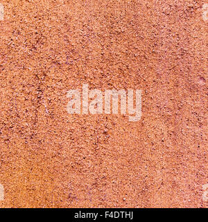 closeup of a rustic brown plastered wall, to be used as texture or background Stock Photo