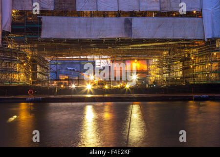 Ship under construction in shipyard at morning. Stock Photo
