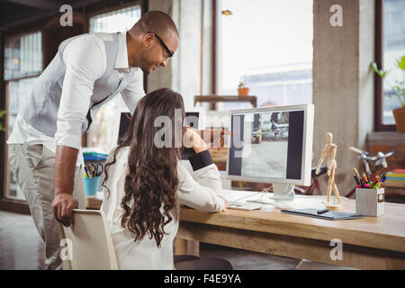 Man and woman discussing over photograph Stock Photo