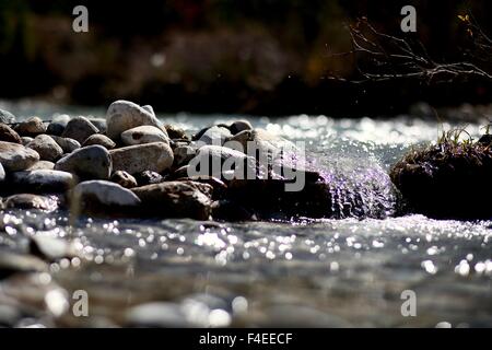 A little waterfall pours over the rocks in Colorado. Stock Photo