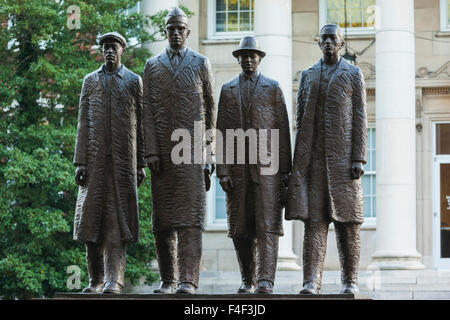 North Carolina, Greensboro, statue of the Greensboro Four, students who staged a sit-in at a Woolworth's lunch counter in 1960 which lead to desegregation during the US civil rights struggle of the early 1960s Stock Photo